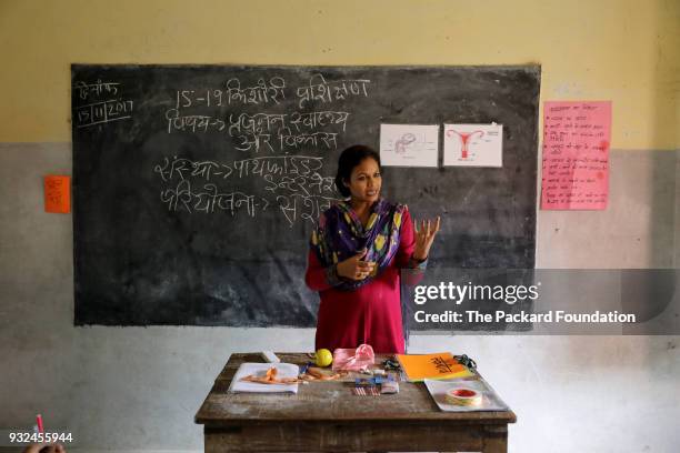 Teacher explains reproductive health systems to students at a village school. Through interactive methods, games, and discussions, the lessons are...