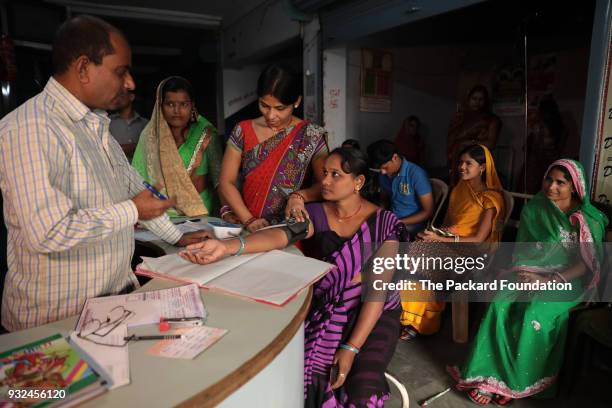 Woman undergoes screening for injectable contraceptive use by a paramedic at a private DIMPA OB-GYN clinic. The Abt Associates-led Private Sector...