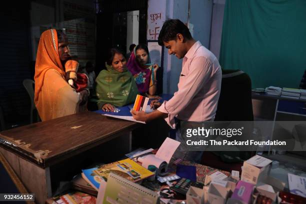 NA pharmacist dispenses medicine at a pharmacy attached to DIMPA, a private OB-GYN clinic. The Abt Associates-led Private Sector Partnerships-One...