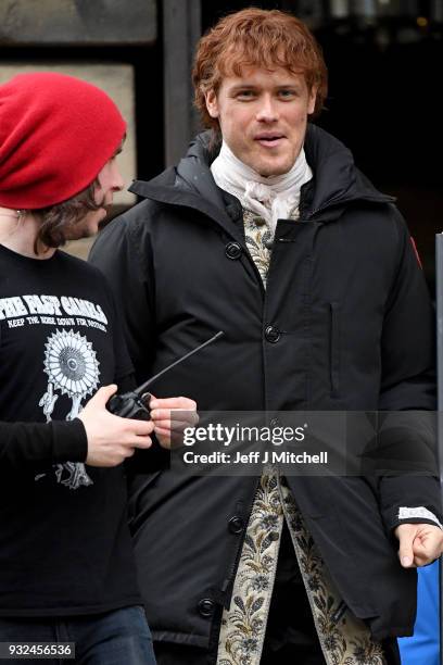 Sam Heughan from the TV series Outlander departs a filming location at St Andrew's Square on March 15, 2018 in Glasgow, Scotland. Dozens of fans have...