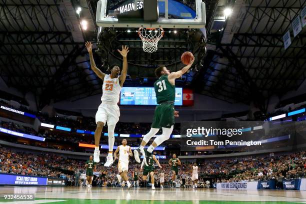 Cole Gentry of the Wright State Raiders goes up for a shot against Jordan Bowden of the Tennessee Volunteers in the first half in the first round of...