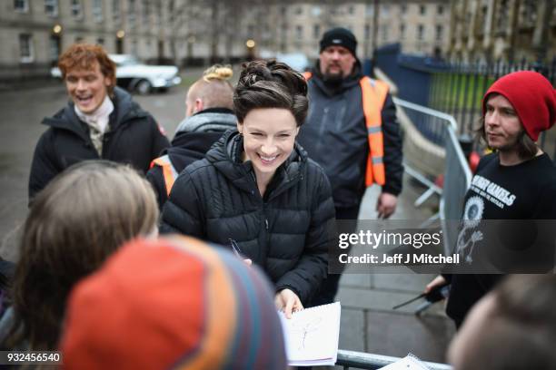 Catriona Balfe and Sam Heughan from the TV series Outlander departs a filming location at St Andrew's Square on March 15, 2018 in Glasgow, Scotland....