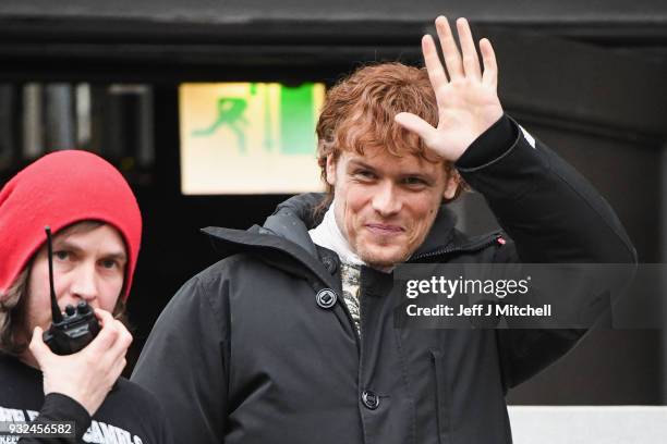 Sam Heughan from the TV series Outlander departs a filming location at St Andrew's Square on March 15, 2018 in Glasgow, Scotland. Dozens of fans have...