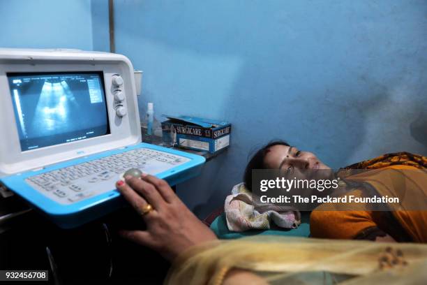 Woman receives an ultrasound check-up at a well-equipped private DIMPA OB-GYN clinic. The Abt Associates-led Private Sector Partnerships-One project...
