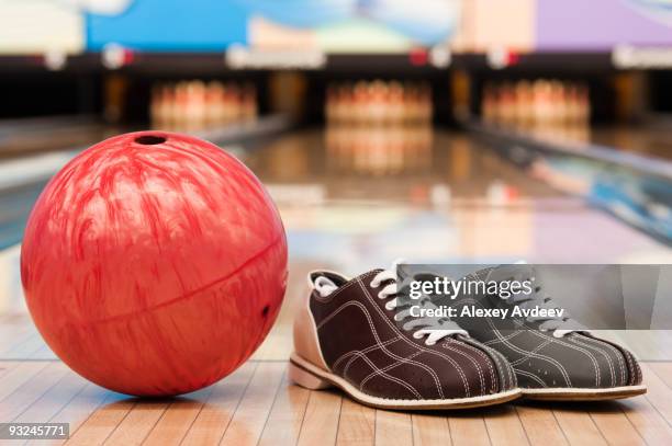 bowling ball and shoes on lane - bowling alley stock pictures, royalty-free photos & images