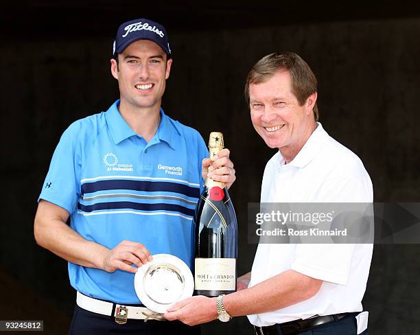 Ross Fisher of England is presented with the October Race to Dubai Golfer of the Month award by George O'Grady, Chief Executive of The European Tour...