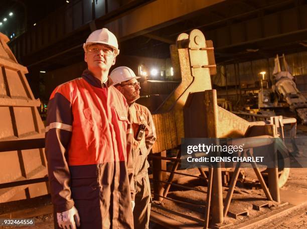 French Economy Minister Bruno Le Maire visits the multinational steel manufacturing corporation Arcelor Mittal plant in Dunkirq on March 15, 2018. /...