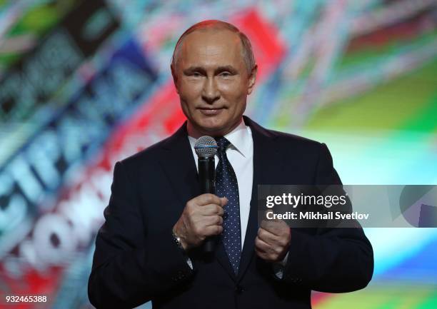 Russian President Vladimir Putin addresses participants at the "Russia, Land of Opportunity" Forum during a concert on March 15, 2018 in Moscow,...