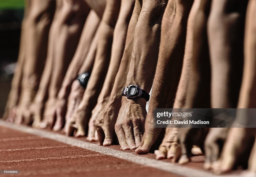 Track Sprinters Lined Up At Starting Line High-Res Stock Photo - Getty ...