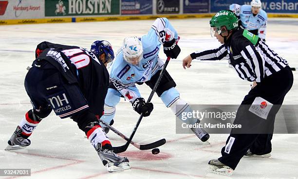 Alexander Barta of Hamburg and Francois Methot of Mannheim wait for the bully during the DEL match between Hamburg Freezers and Adler Mannheim at the...