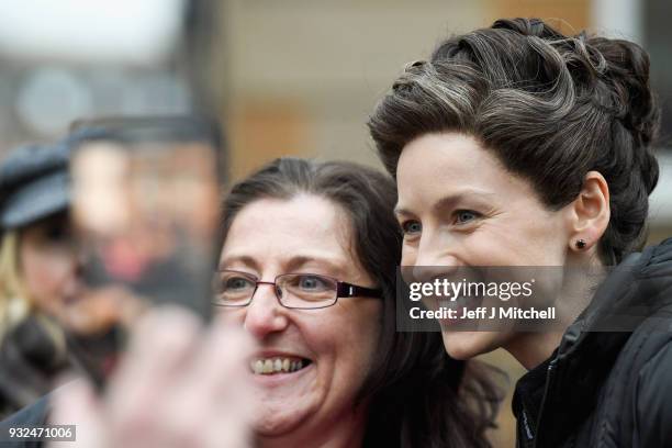 Catriona Balfe from the TV series Outlander departs a filming location at St Andrew's Square on March 15, 2018 in Glasgow, Scotland. Dozens of fans...