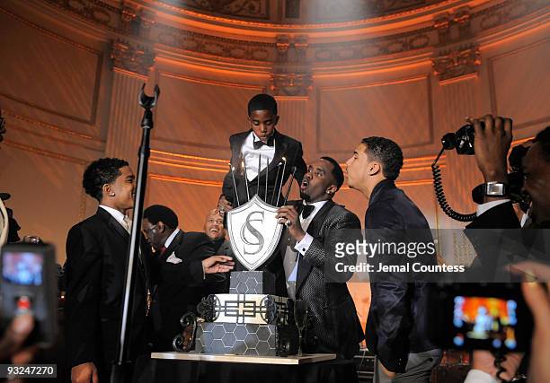 Hip hop mogul Sean "Diddy" Combs is joined by his sons Justin Combs , Christian Combs and Quincy Brown on stage to blow out candles on his 40th...