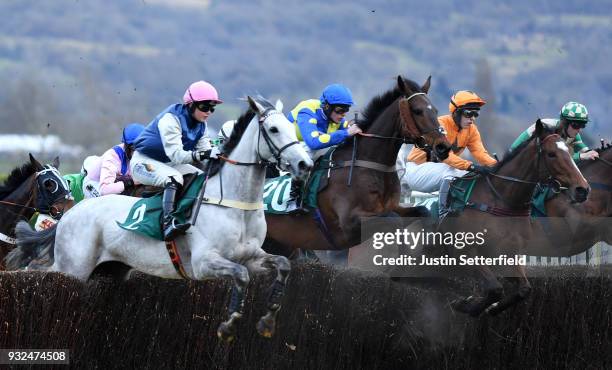 Aubusson ridden by Chester Williams and Captain Bucks ridden by Loran Williams take the last fence during the Fulke Walwyn Kim Muir Challenge Cup...