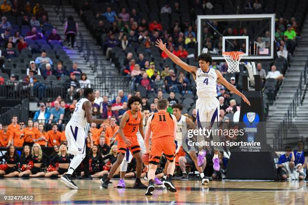 Washington guard Matisse Thybulle defends Oregon State guard Zach Reichle during the first round game of the mens Pac-12 Tournament between the...