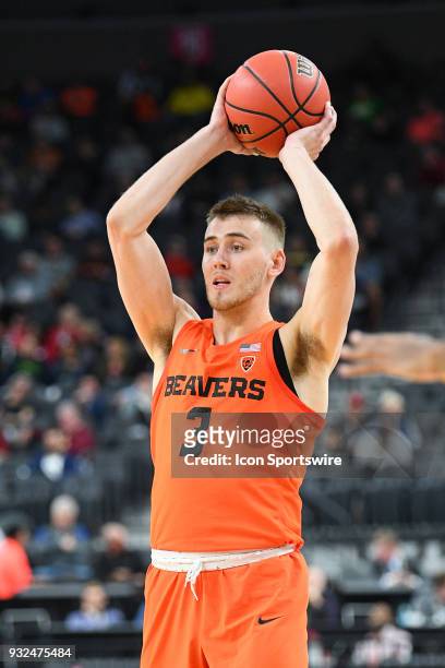 Oregon State forward Tres Tinkle looks to make a pass during the first round game of the mens Pac-12 Tournament between the Washington Huskies and...