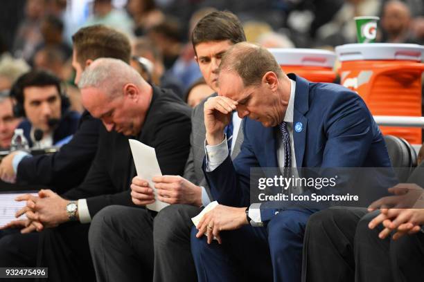 Washington head coach Mike Hopkins looks down during the first round game of the mens Pac-12 Tournament between the Washington Huskies and the Oregon...