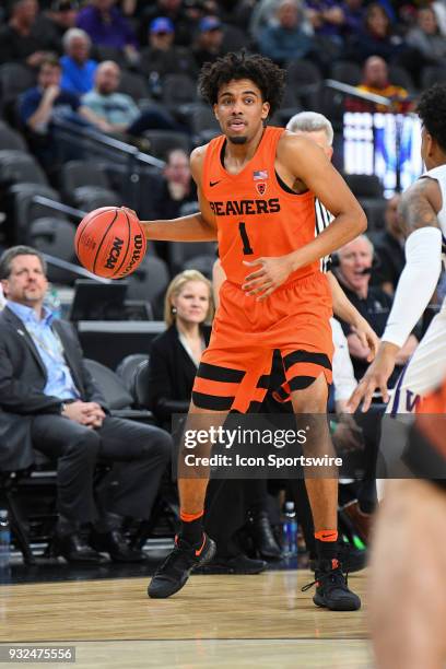 Oregon State guard Stephen Thompson Jr. Looks to make a pass during the first round game of the mens Pac-12 Tournament between the Washington Huskies...