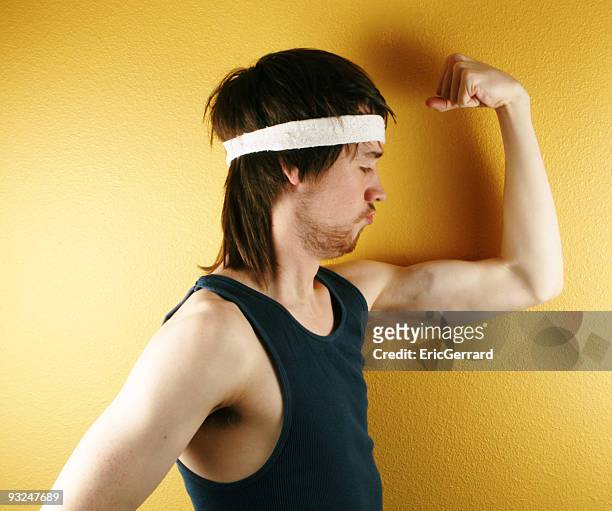 man posing in retro workout clothes flexing muscle - mullet haircut stock pictures, royalty-free photos & images