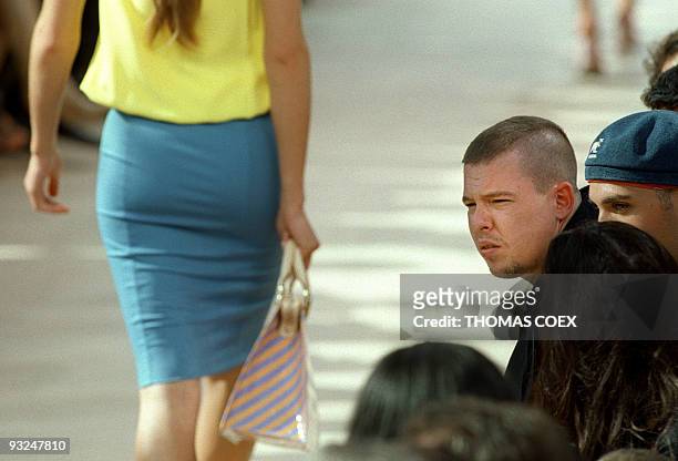Givenchy fashion designer Alexander Mac Queen is seen at the presentation of the Louis Vuitton Spring/Summer 2000 ready-to-wear collection designed...