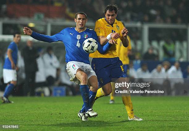 Giorgio Chiellini of Italy is challenged by Johan Elmander of Sweden during the international friendly match between Italy and Sweden at Dino Manuzzi...