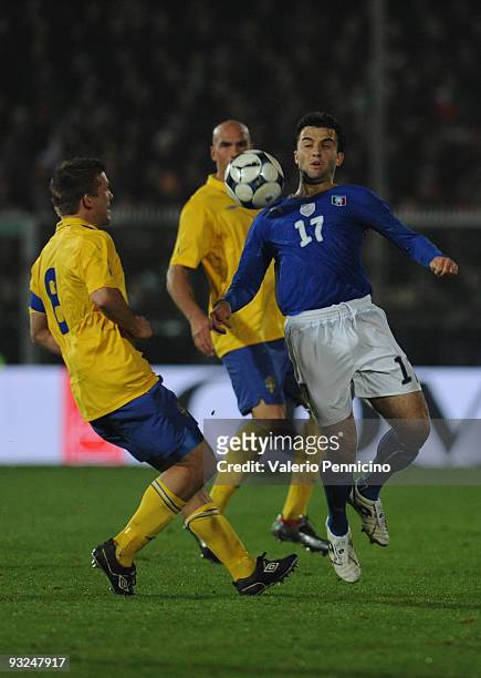 Giuseppe Rossi of Italy is challenged by Anders Svensson of Sweden during the international friendly match between Italy and Sweden at Dino Manuzzi...