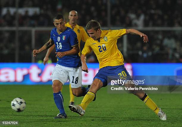 Angelo Palombo of Italy is challenged by Pontus Wernbloom of Sweden during the international friendly match between Italy and Sweden at Dino Manuzzi...