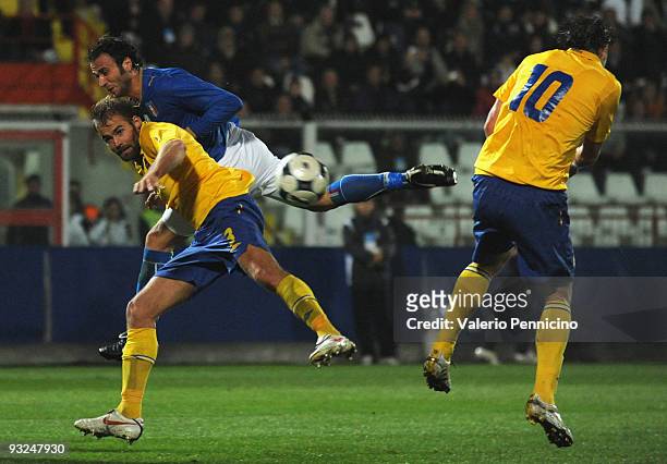 Giampaolo Pazzini of Italy clashes with Olof Mellberg of Sweden during the international friendly match between Italy and Sweden at Dino Manuzzi...