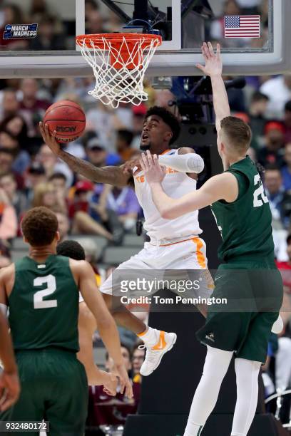 Jordan Bone of the Tennessee Volunteers goes up for a shot against Parker Ernsthausen of the Wright State Raiders in the first round of the 2018 NCAA...