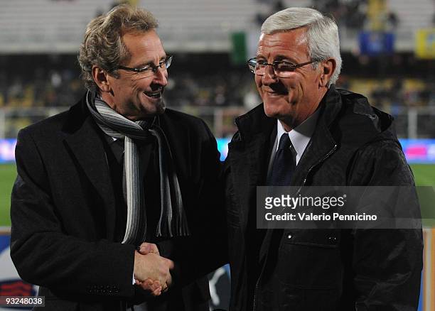Italy head coach Marcello Lippi and Sweden head coach Erik Hamren of Sweden poses for photographers during the international friendly match between...