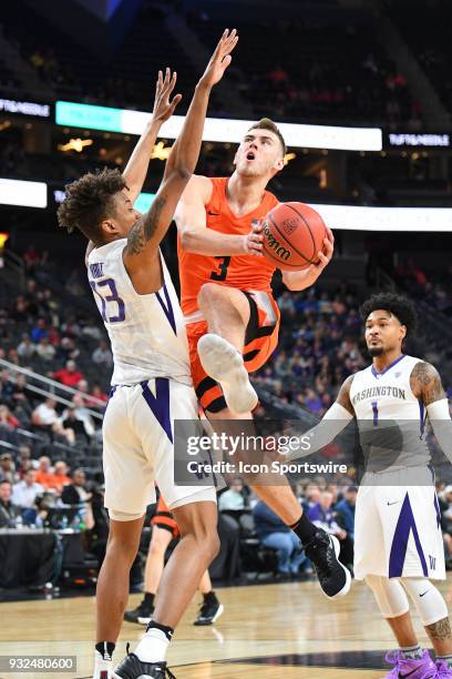 Oregon State forward Tres Tinkle drives to the basket during the first round game of the mens Pac-12 Tournament between the Washington Huskies and...