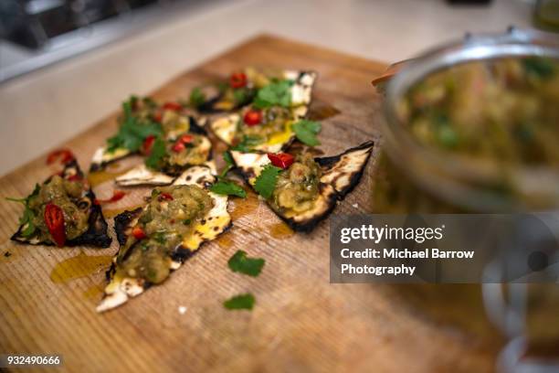 food on rustic chopping board - chopping cilantro stock pictures, royalty-free photos & images