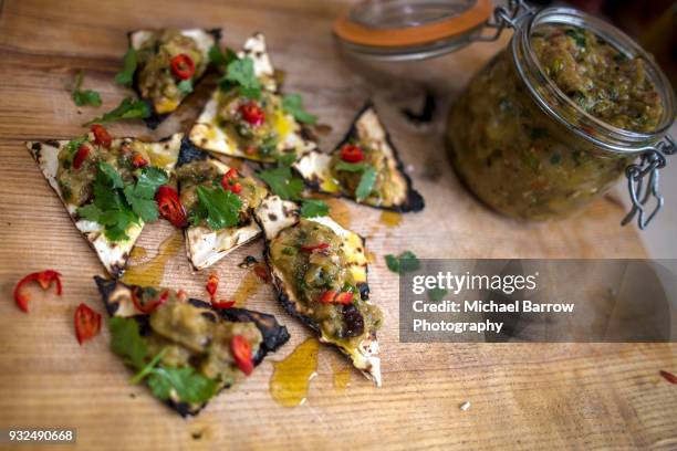 food on rustic chopping board - chopping cilantro stock pictures, royalty-free photos & images
