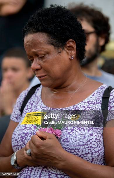 Mourner expresses her grief, during the funeral of slain Brazilian councilwoman and activist Marielle Franco, outside Rio de Janeiro's Municipal...