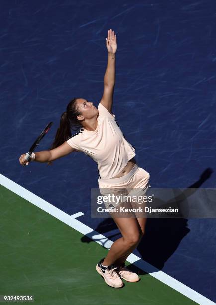 Daria Kasatkina of Russia serves against Angelique Kerber of Germany during Day 9 of BNP Paribas Open on March 15, 2018 in Indian Wells, California.