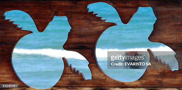 The sea appears through a sea turtle wooden fretwork in the TAMAR Project's Visitor Center in Praia do Forte, Bahia State, on November 13, 2009. The...