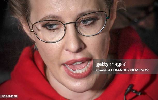 Russian TV journalist and presidential candidate Ksenia Sobchak talks to media after her meeting with supporters in Moscow on March 15, 2018....
