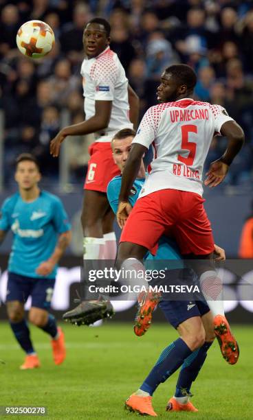 Leipzig's French defender Ibrahima Konate, Zenit St. Petersburg's Anton Zabolotny and Leipzig's French defender Dayot Upamecano vie for the ball...