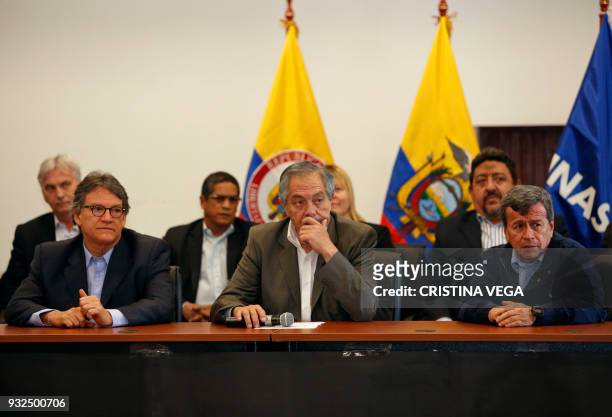 The head of the Colombian government negotiating team Gustavo Bell, Ecuador's roving ambassador Juan Meriguet and National Liberation Army guerrilla...