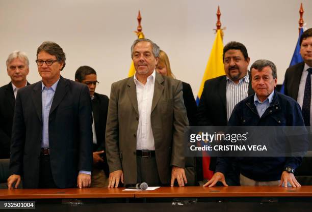 The head of the Colombian government negotiating team Gustavo Bell, Ecuador's roving ambassador Juan Meriguet and National Liberation Army guerrilla...