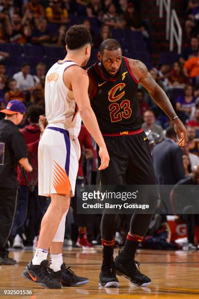 Devin Booker of the Phoenix Suns and LeBron James of the Cleveland Cavaliers greet each other before the game on March 13, 2018 at Talking Stick...