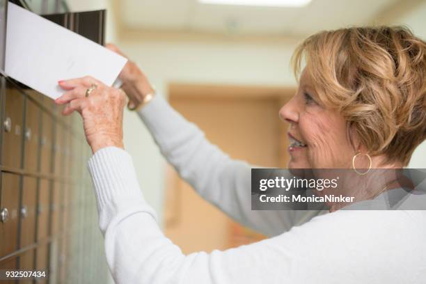Senior Woman Getting The Mail High-Res Stock Photo - Getty Images