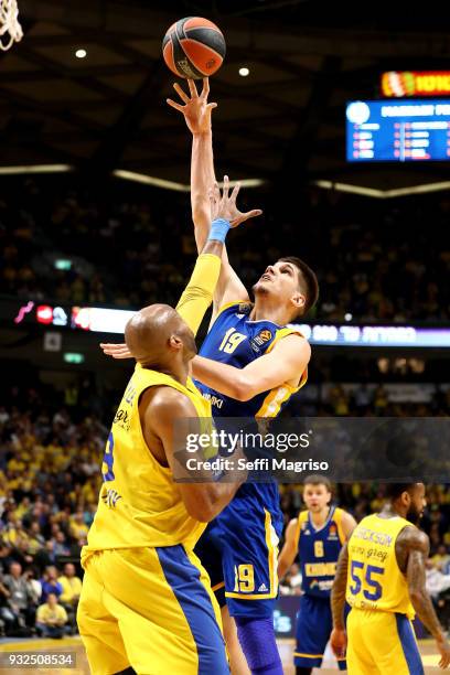 Marko Todorovic, #19 of Khimki Moscow Region competes with Alex Tyus, #9 of Maccabi Fox Tel Aviv during the 2017/2018 Turkish Airlines EuroLeague...