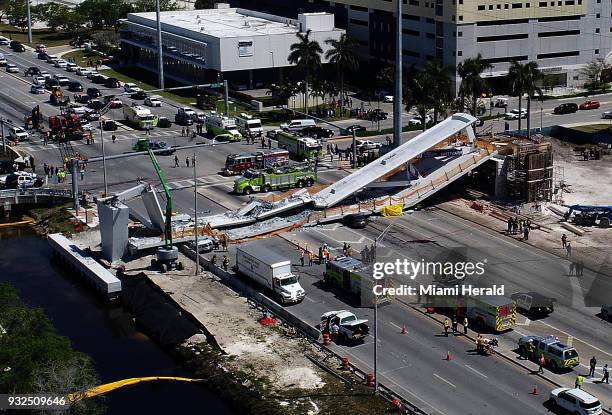 View of the main span of the FIU-Sweetwater UniversityCity Bridge after collapsing five days after been installed over SW 8 Street-State Road 41 on...
