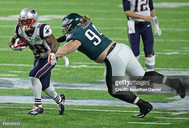 Beau Allen of the Philadelphia Eagles grabs James White of the New England Patriots during Super Bowl Lll at U.S. Bank Stadium on February 4, 2018 in...