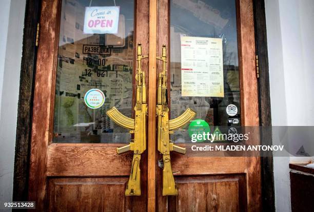 The entrance of the "Intelligence" spy themed bar near the famous KGB and current FSB building on Lubyanka square is seen in Moscow on March 15,...