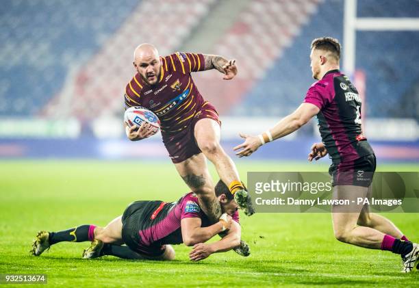 Huddersfield Giants' Dale Ferguson breaks through Hull's line during the Betfred Super League match at the John Smith's Stadium, Huddersfield.