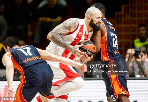 Pero Antic of Crvena Zvezda in action against Latavious Williams and Rafa Martinez of Valencia during the 2017/2018 Turkish Airlines EuroLeague...