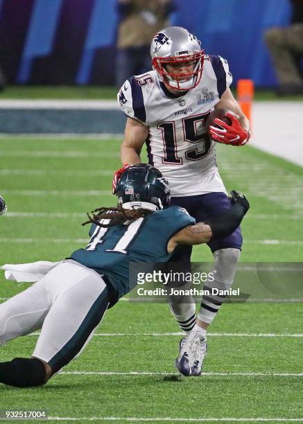 Ronald Darby of the Philadelphia Eagles hits Chris Hogan of the New England Patriots during Super Bowl Lll at U.S. Bank Stadium on February 4, 2018...