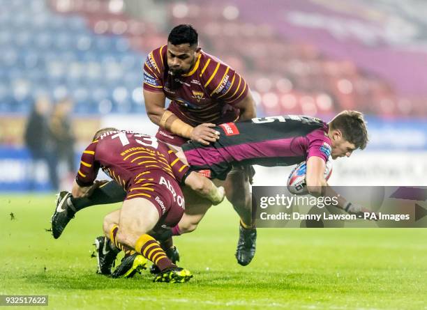 Huddersfield Giants' Ryan Hinchcliffe and Ukuma Ta'ai tackle Hull KR's Ryan Shaw during the Betfred Super League match at the John Smith's Stadium,...