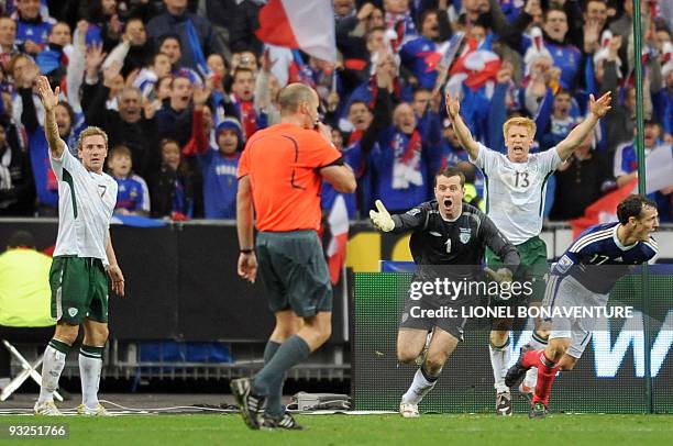 Irish national football team midfielder Liam Lawrence , goalkeeper Given and defender Paul Mc Shane shout to Swedish referee Martin Hansson as French...